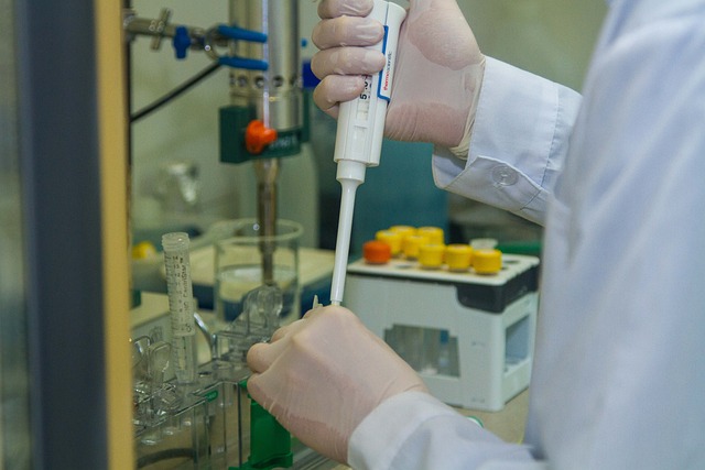 Scientists working in a laboratory, using optical fiber sensors to conduct research for fast and affordable arsenic detection. They are focused on the equipment, with optical fiber sensors and testing materials visible on the table.